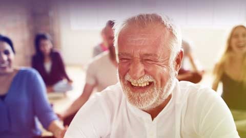 Man laughing at yoga