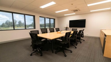 Boardroom - boardroom style room with large windows offering natural lighting