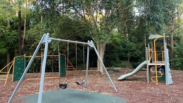 playground surrounded by trees