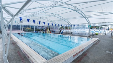 Enclosed heated program swimming pool