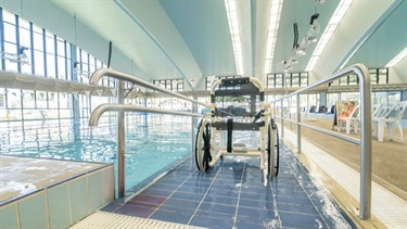 Indoor heated program swimming pool ramp access