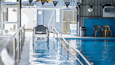 Indoor heated program swimming pool ramp access