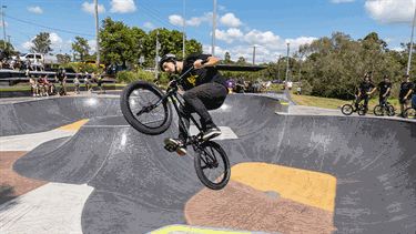 A man performing a trick on a bike.