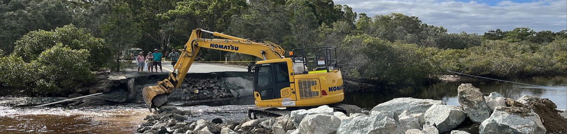 Excavator in road works