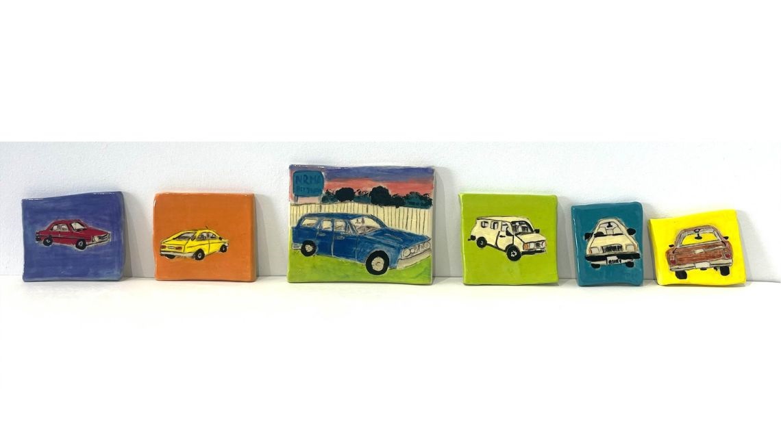 Various coloured ceramic tiles featuring artwork of cars