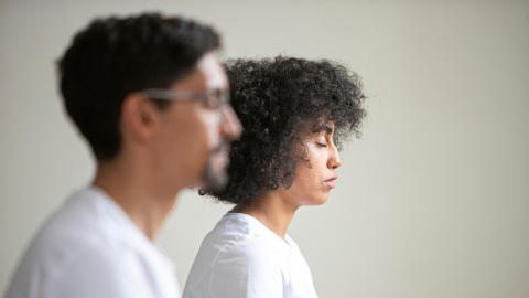 two people meditating