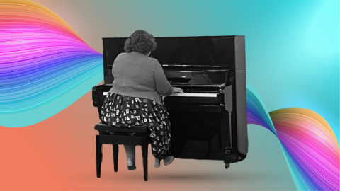 a woman playing black grand piano with rainbow and blue background