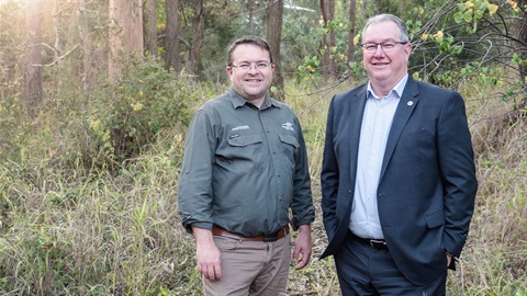 Mayor Peter Flannery and Councillor Matt Constance standing at the entry of Moreton Bay's latest land buyback location