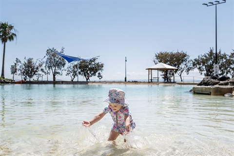 Child playing in water at Settlement Cove Lagoon Redcliffe