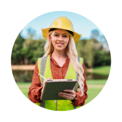 Ashleigh Murray wearing a hard hat and holding a clipboard