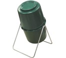 Green compost barrel with a silver A frame holding it off the ground on an angle. 