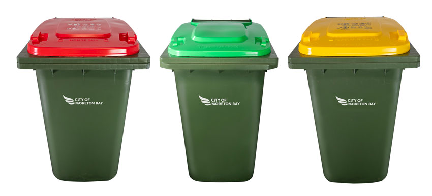 Councils red lidded waste bin, green lided GO bin and yellow lidded recycling bin