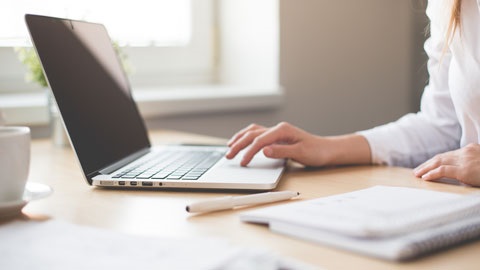 Person typing on laptop